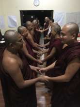 Monks and nuns closing circle for learning trip