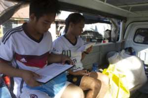 The coaches being transported across Tacloban