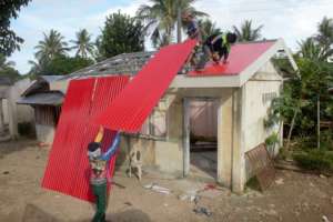 Up goes the new roof