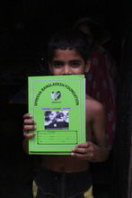 Spreeha student shows off his notebook