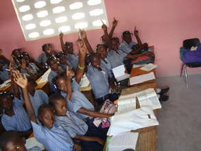 Children using their books in class