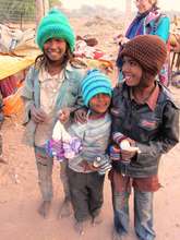 Local children receiving woolly hats..!