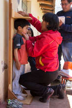 measuring the children to see their progress