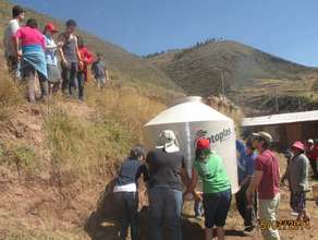volunteers implement water tanks