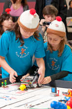 FIRST LEGO League team demonstrating their robot