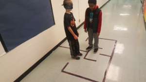 Students using Coding Directions to Navigate Maze