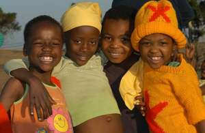 Children enjoy the playground at Loaves & Fishes