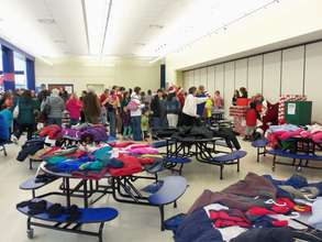 Children line up to see Santa and receive Gifts