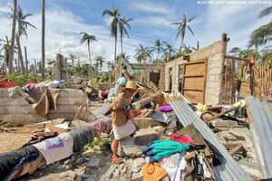 DaanBantayan resident surveys her home