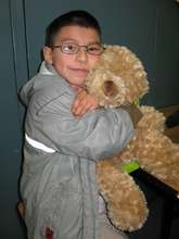 A boy bonds with his stuffed bear
