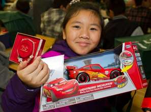 A happy girl and her new racecar