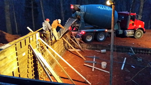 Concrete Mixer Pours Footings for New Building