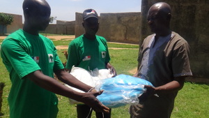 Kabiru receiving his Insecticide Treated Nets