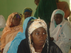 Women listening in on at the outreach