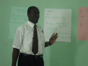 One of our outreach doctor explaining malaria