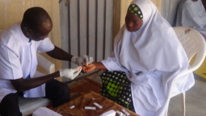 Sagir testing a pregnant volunteer woman