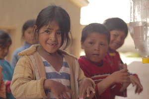 Kids practicing the habit of washing hands