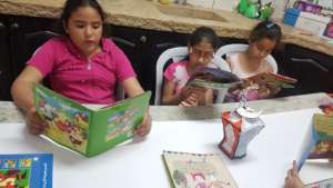 Kids reading stories before Ramadan & exams