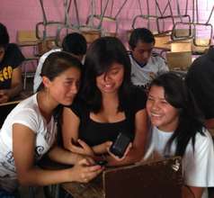 Girls telling about their science project.