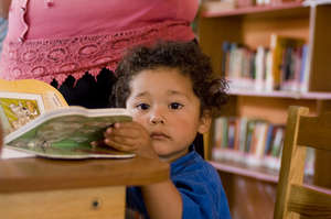 A new reader in the library (Zacualpa, Guatemala)