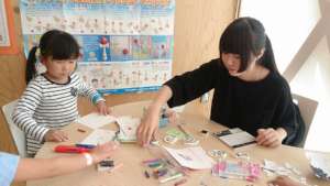 Children making bookmarks