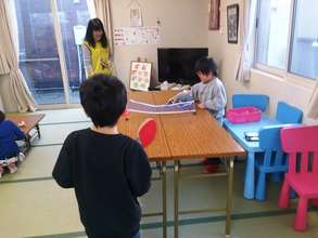 Children playing in temporary house
