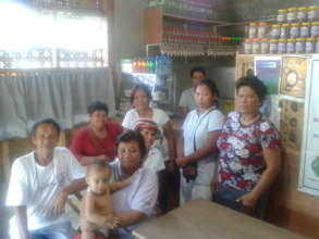 TOFA members pose with their products
