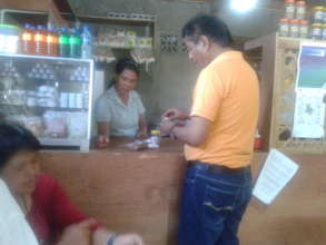customer buying herbal products at the store