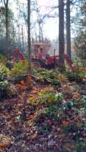Volunteer clearing fire line on our tractor