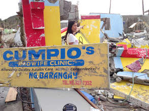 Nerissa in ruins of her birth center, post-storm