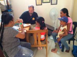 Our volunteer Rina interprets for the mothers