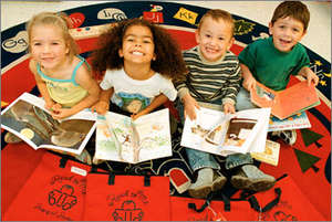 RAR kids receiving their new books & new red bags!