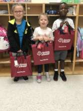 RAR Bright Red Book Bags and Happy Children!