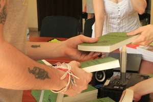 Giving out books to the attendees, Ozurgeti, July
