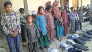 Children receiving materials to rejoin schools