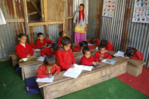 Saptamai students with ETC-provided desks/supplies