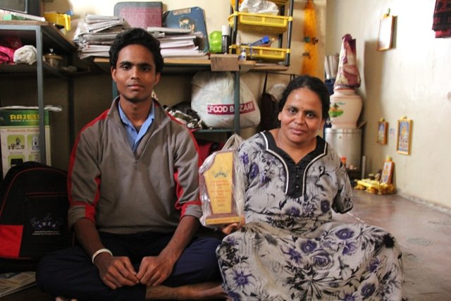 Akash and his mother at their home