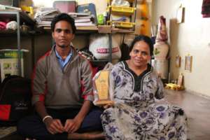 Akash and his mother at their home