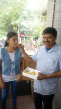 Sandhya celebrating with her father