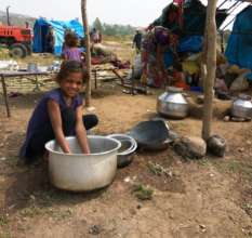 Priya washing vessels at home