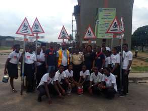 Signage for Agidingbi-students with Road officials