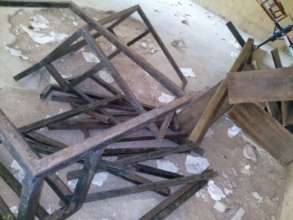 Before  - Broken furniture in abandoned classroom
