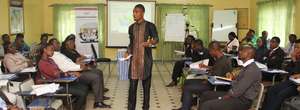 Mock facilitation by a participant at the workshop
