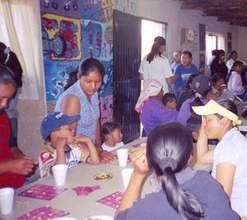 Pima kids playing with their families
