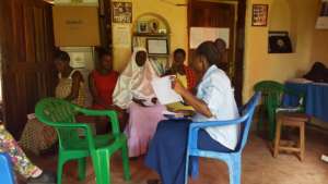 Ritah teaching a nutrition workshop