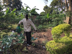 Kato, Head Groundskeeper, watering plants