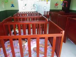 The new cribs and a happy sleeper!