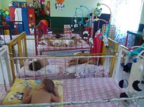 Babies sometimes have to sleep two per crib...