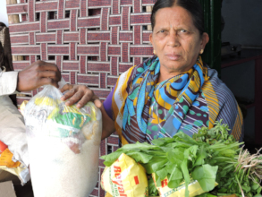Elderly person in AndhraPradesh getting food suppo
