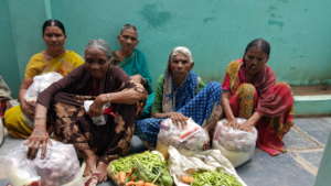 India poor elderly persons getting food support